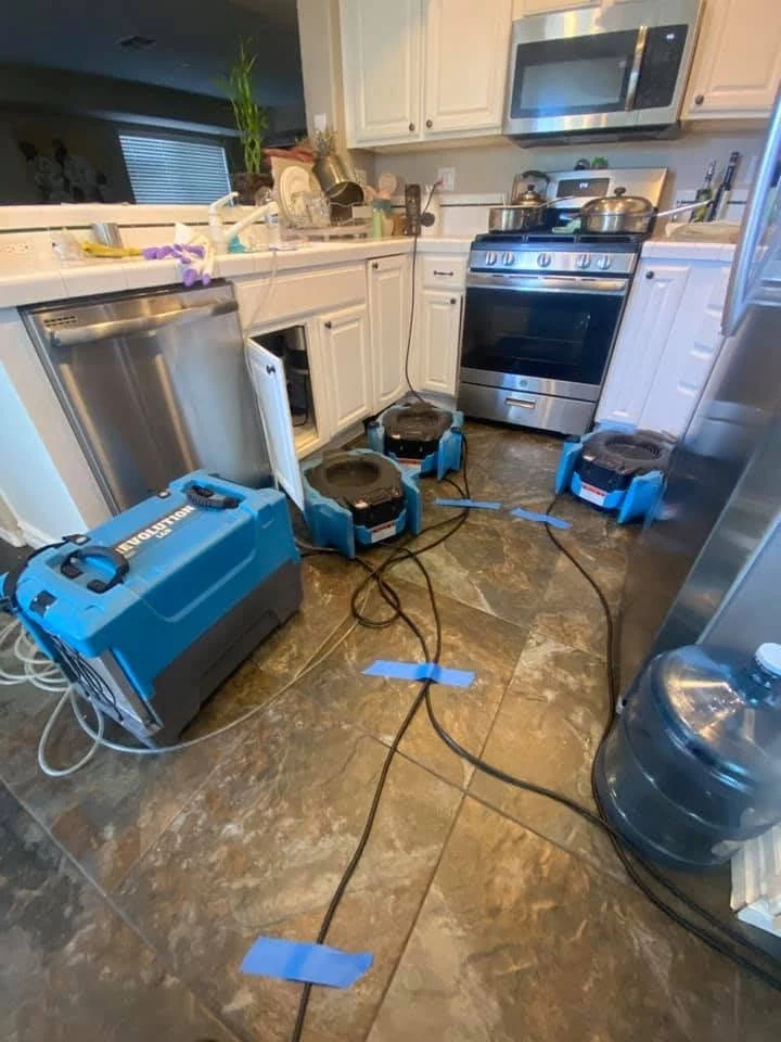 Water damage drying equipment in a kitchen