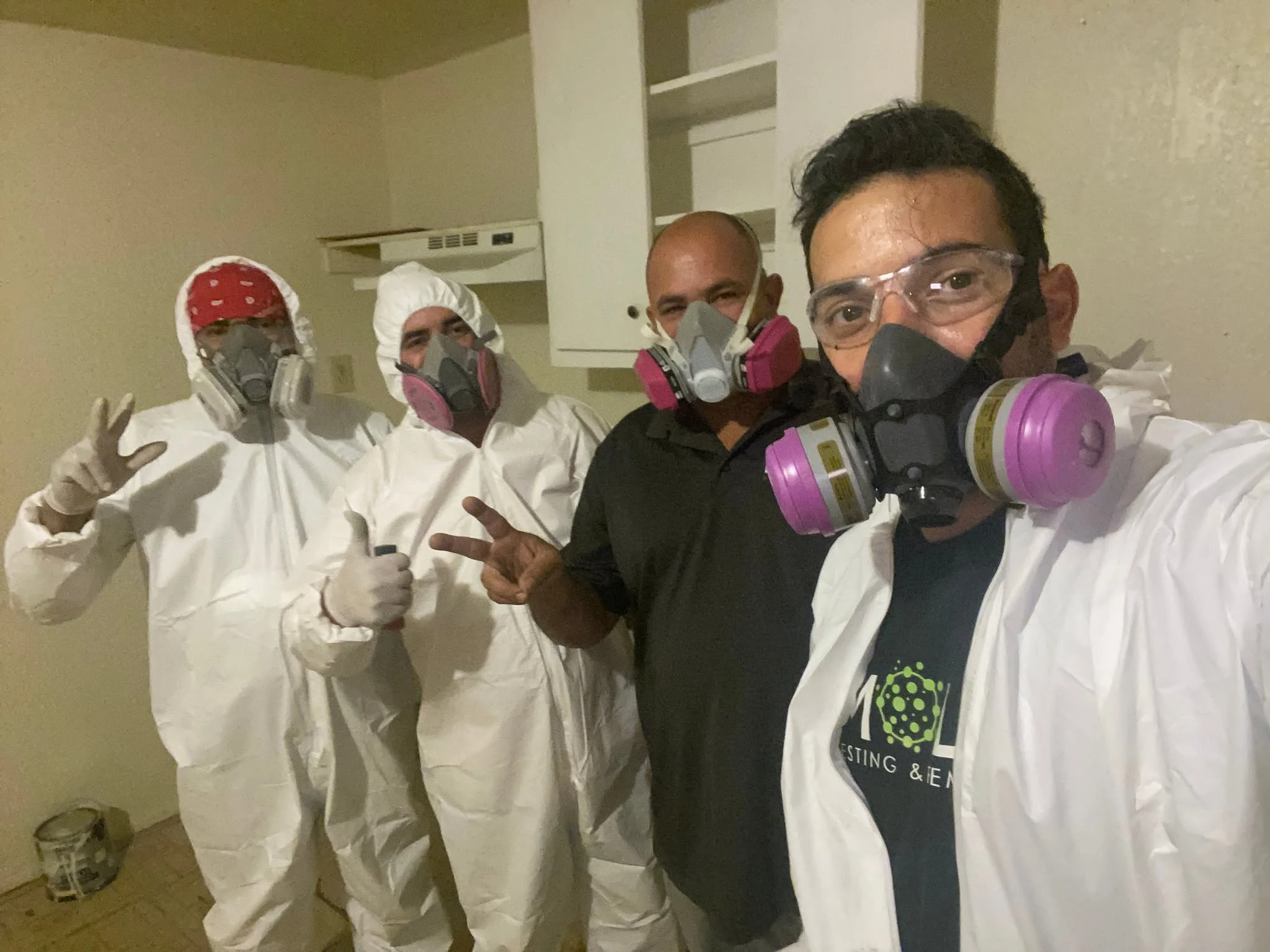 Mold remediation crew wearing protective equipment