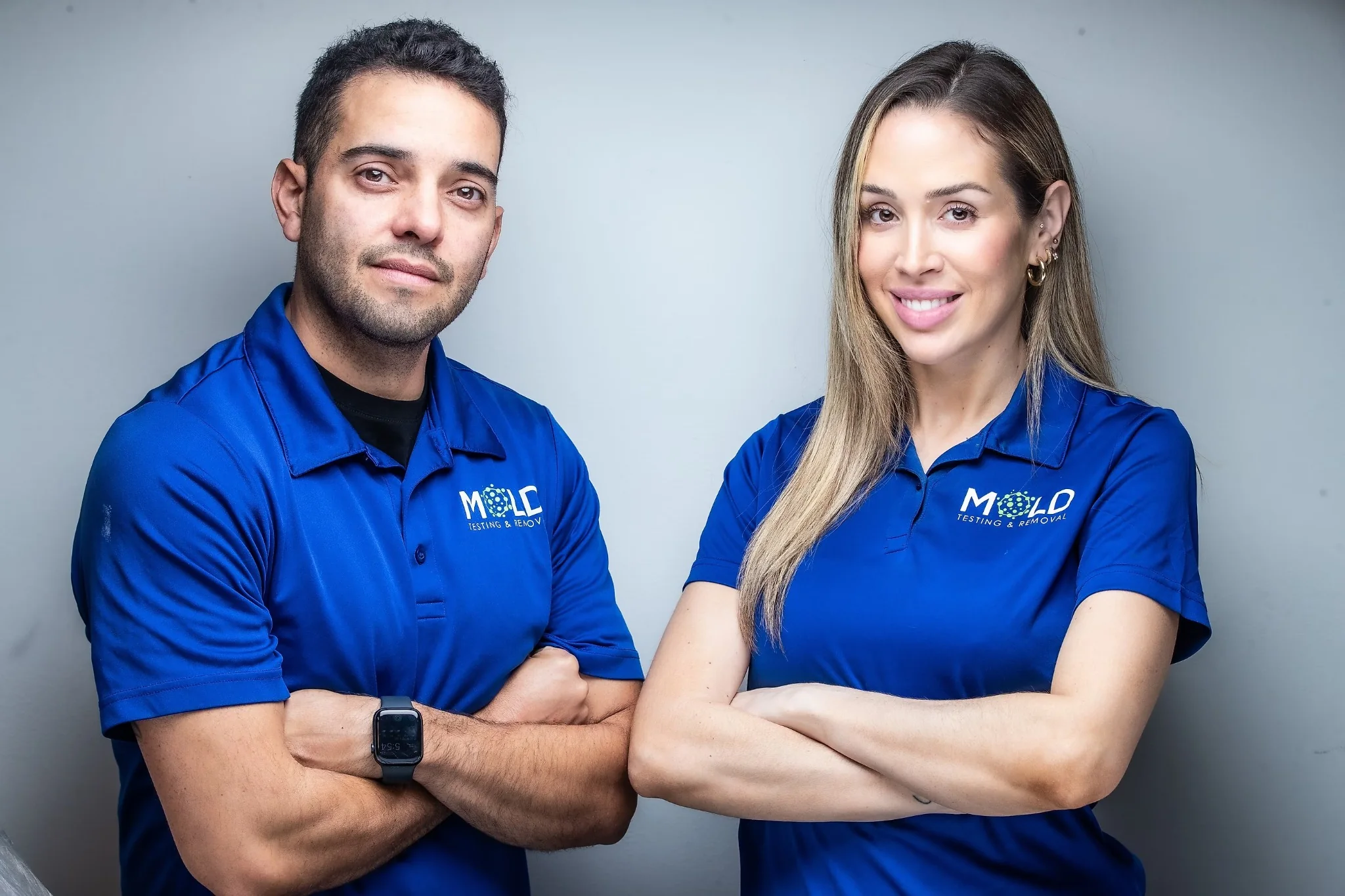 Mold Testing and Removal Services team in blue uniforms